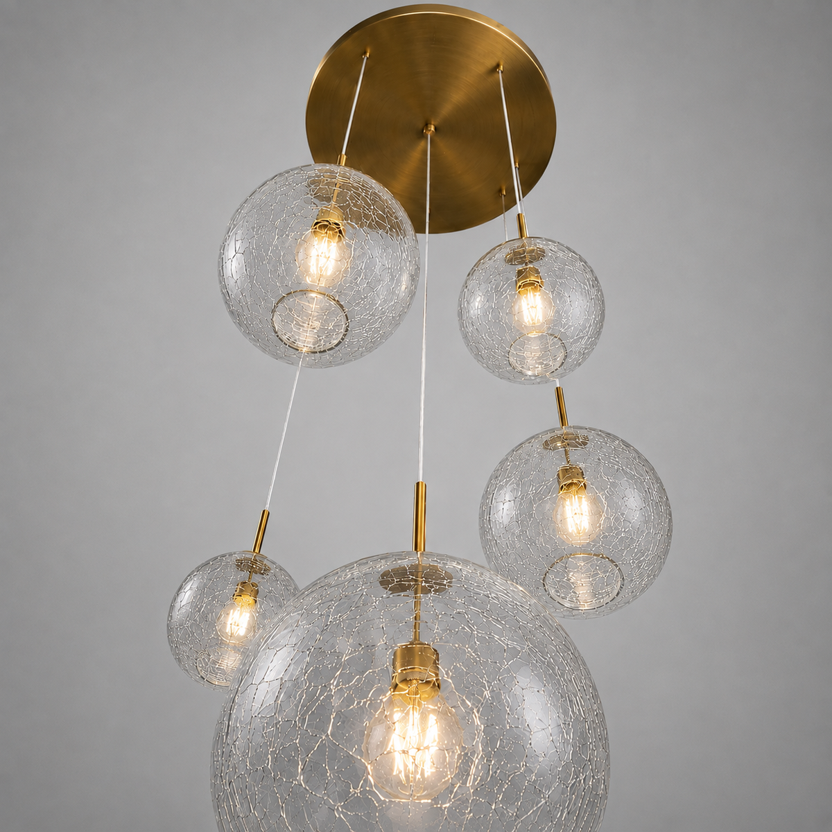 Underside of the 5-light colored glass pendant showing the shades and brass canopy — CLND008