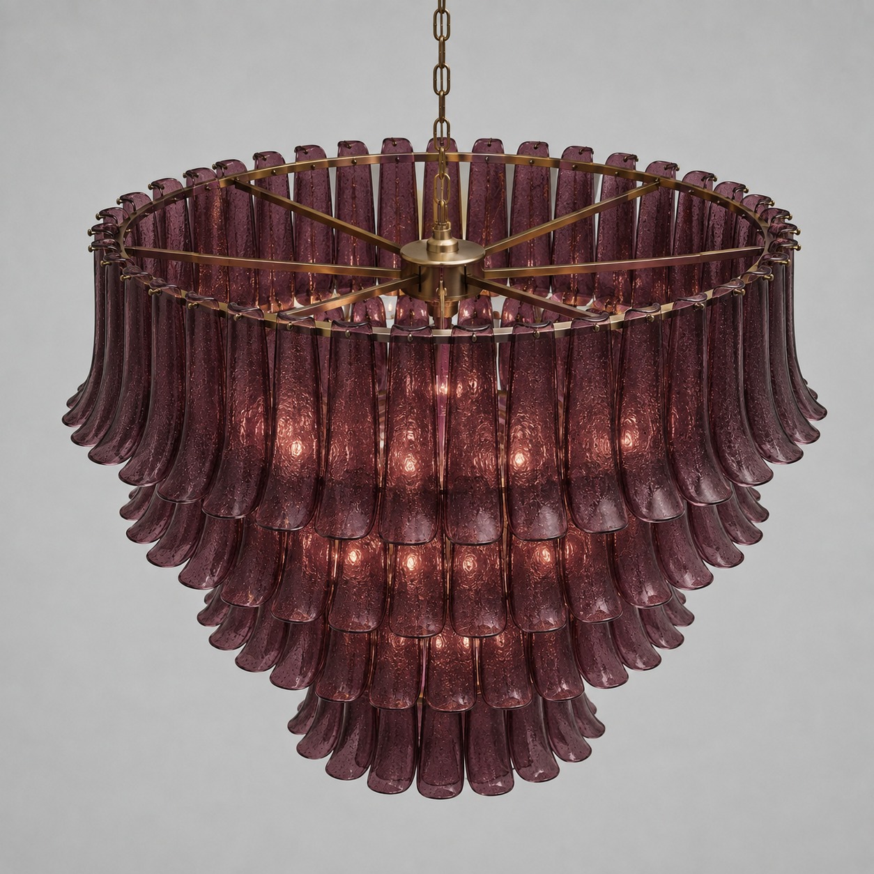 Side profile of the sculptural glass and brass chandelier showing depth and drop — CLND006