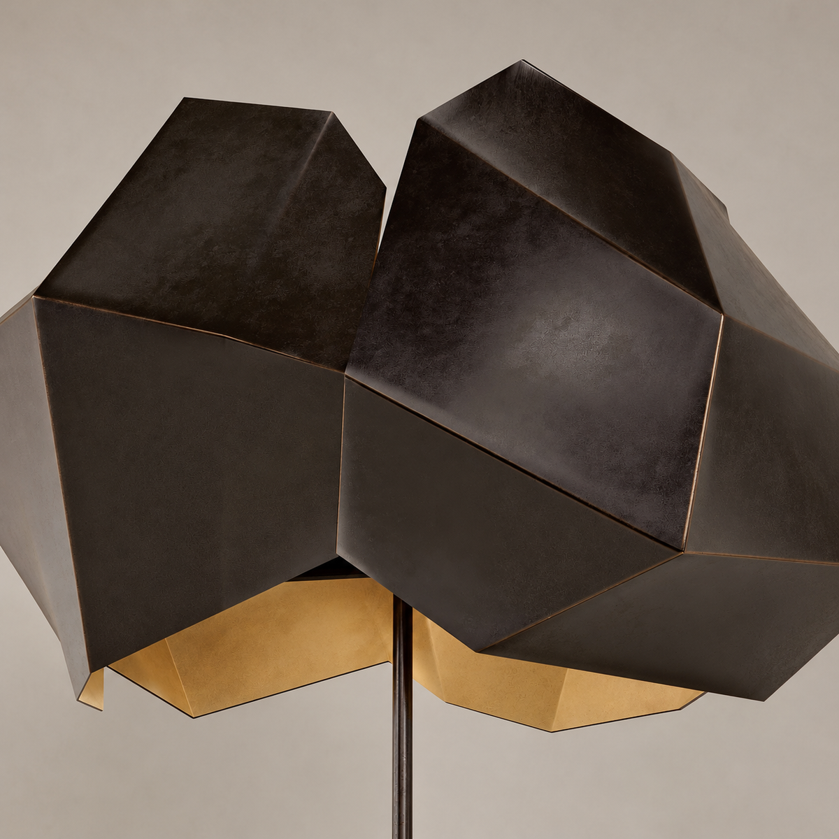 Close view of Aventine’s folded black metal panels and gold-toned inner shade
