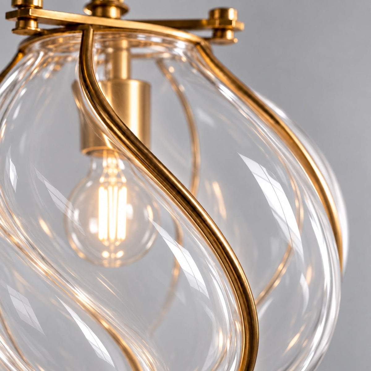 Bulb visible through the clear twisted glass of the Belluno lantern pendant CLND038-C