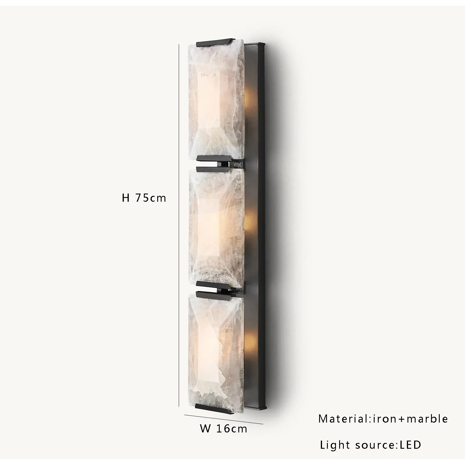 Black triple calcite sconce in a hallway