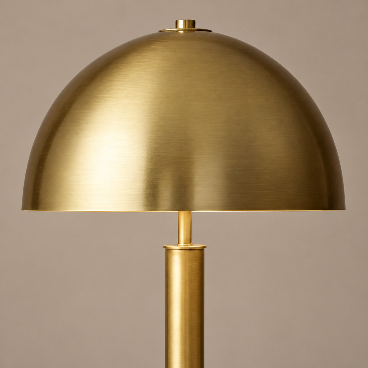 Close view of the brushed brass dome and stem.