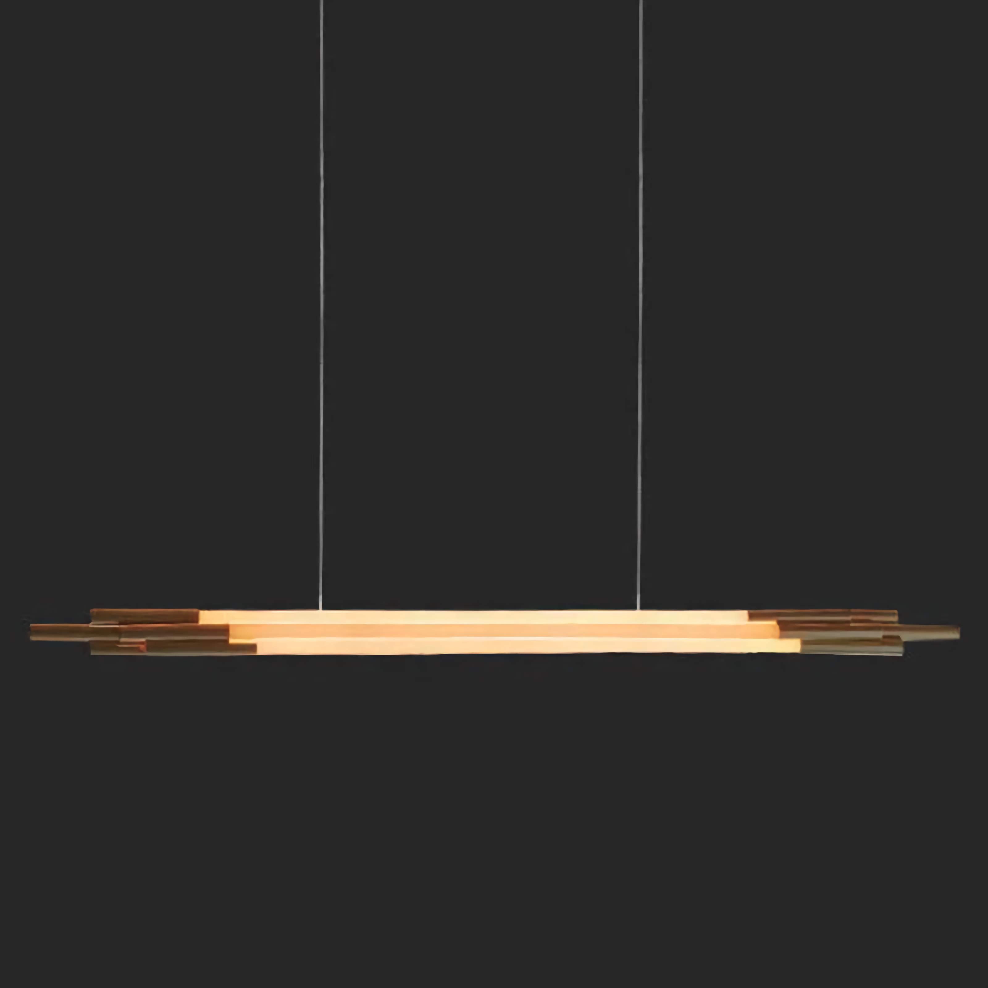 Bronze linear pendant over a kitchen island