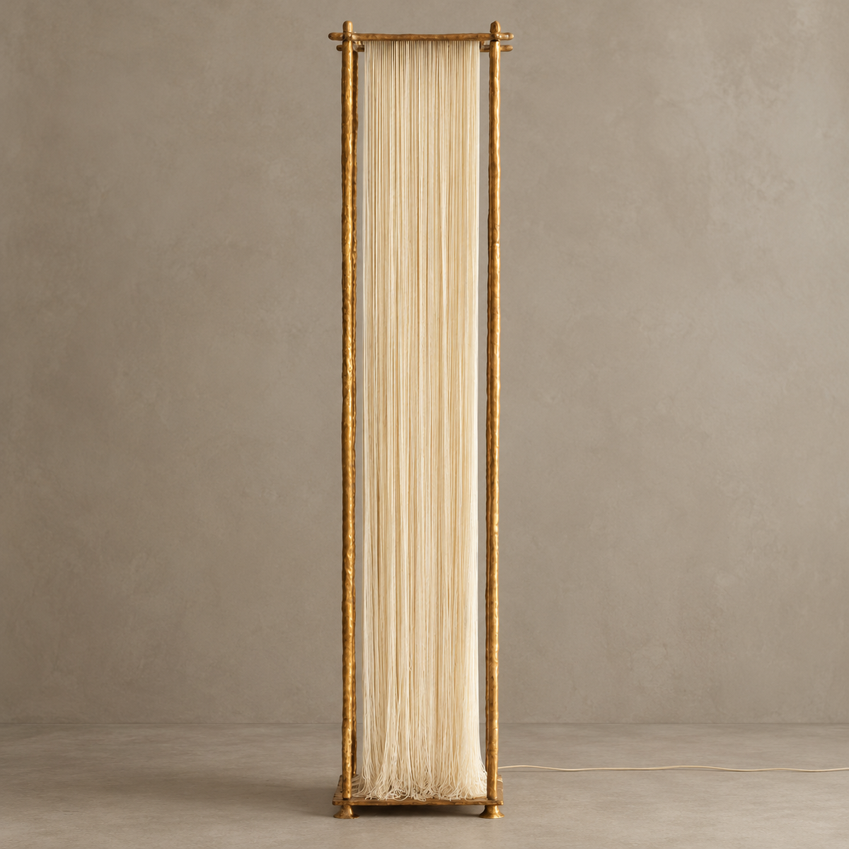 Cascade floor lamp switched off, with ivory silk strands hanging inside a hammered gold-tone frame.