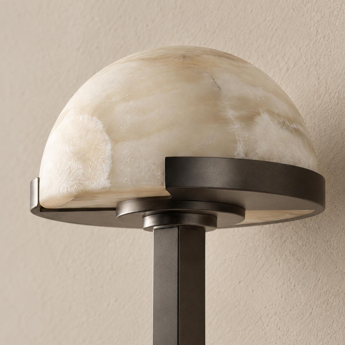 Detail of natural alabaster and the black steel shade supports.