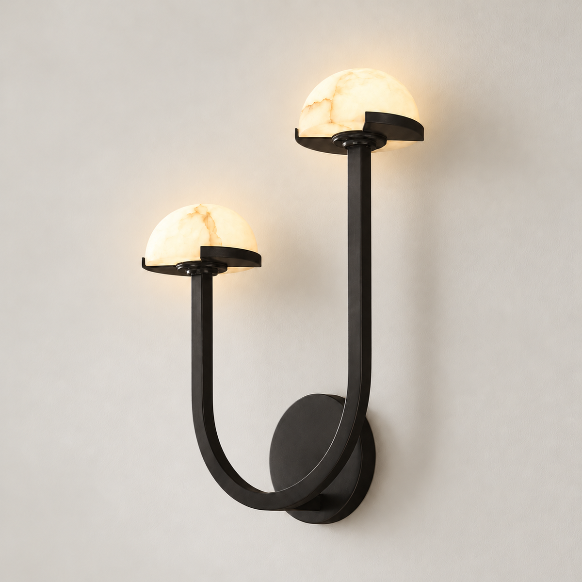 Right-hand double alabaster wall sconce with both stone domes illuminated.