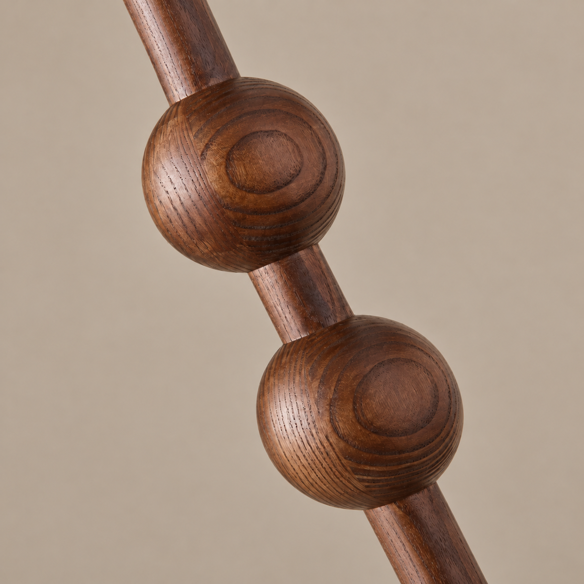 Close-up of two walnut-tone beads and the straight connector on the CL40XZ8 stem.