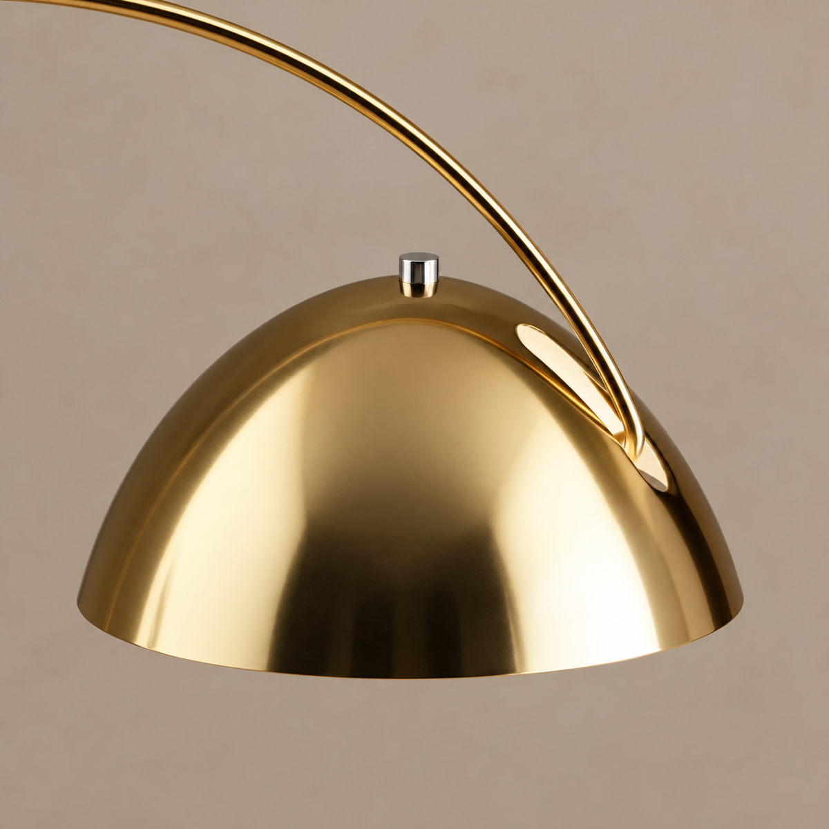 Close view of the CL55124 gold metal dome, silver finial and curved arm attachment.
