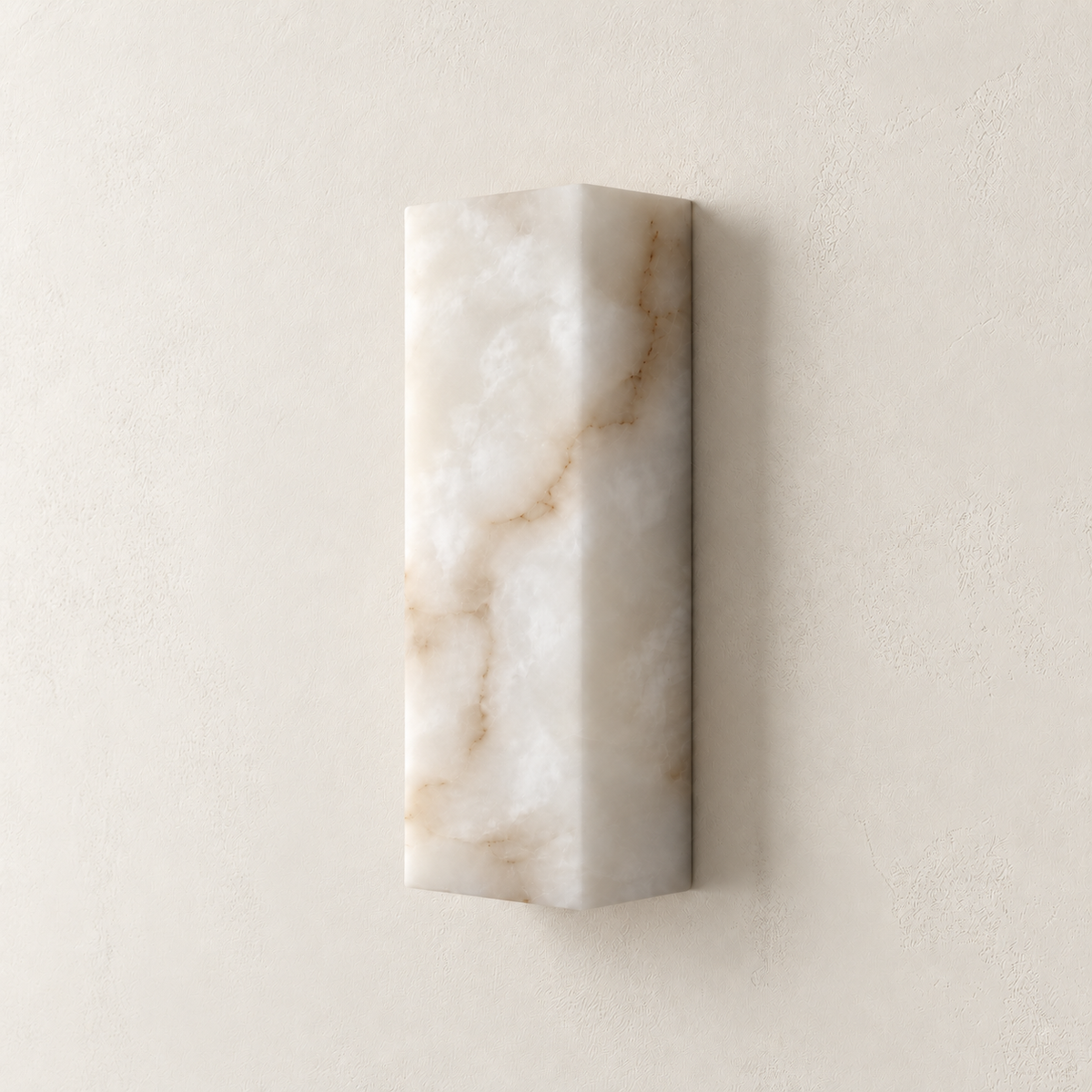 Angled view of the small CLAW025 wall lamp showing its solid alabaster front and side.
