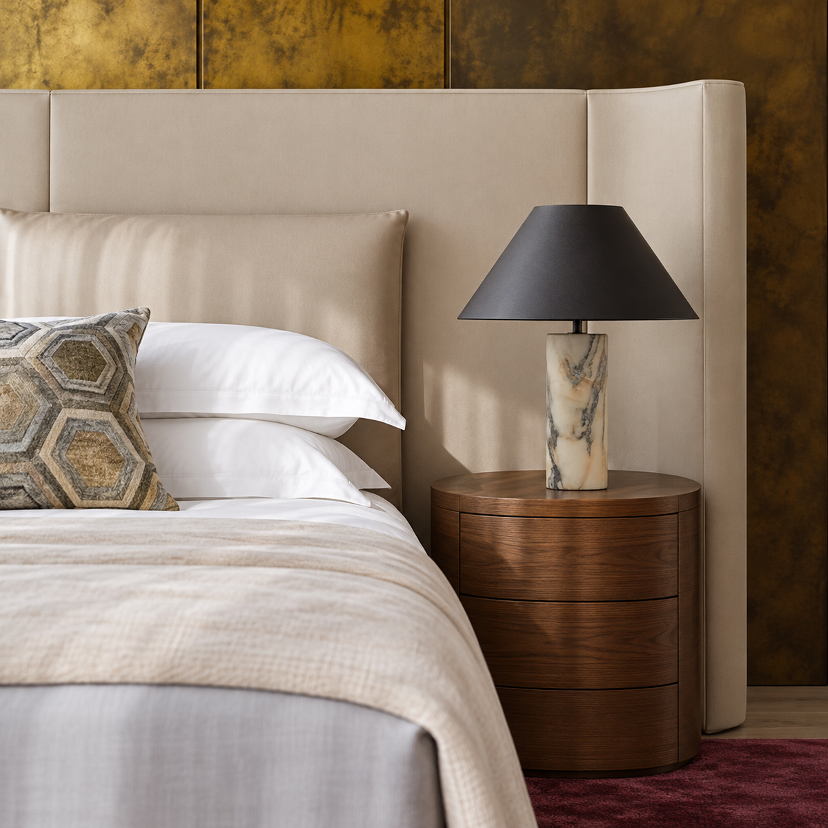 Black and marble table lamp on a walnut bedside table.