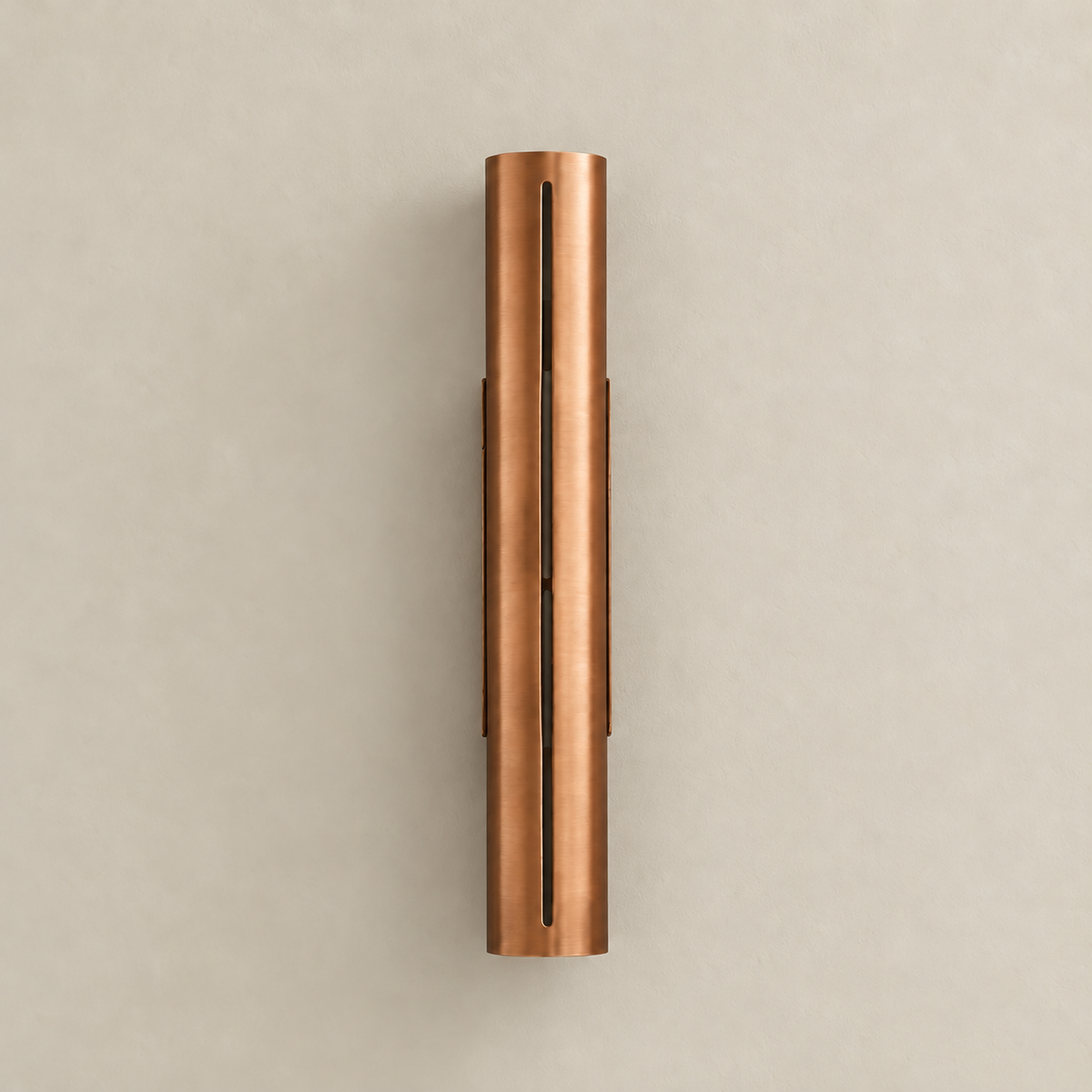 Front view of the unlit 55 cm copper cylinder wall light and its vertical slit.