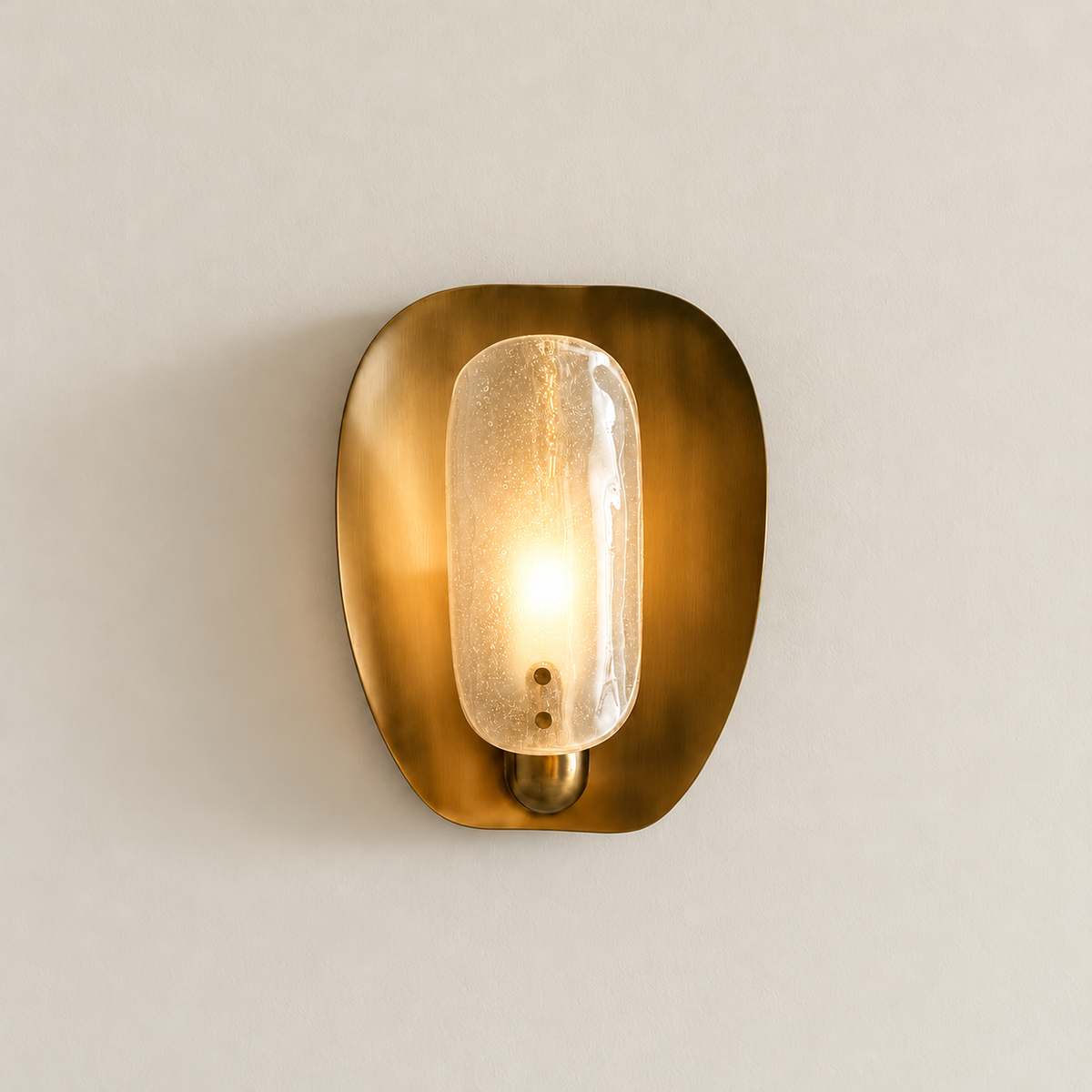 CLDW56 brass and bubbled glass wall sconce illuminated on the same warm ivory background.