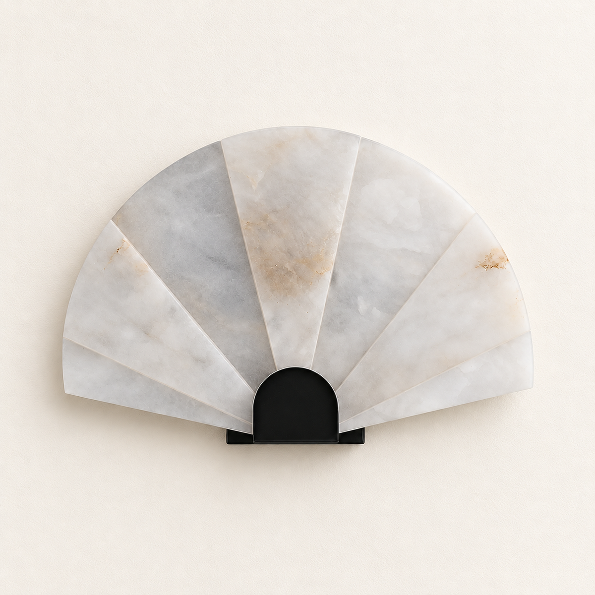 Alabaster fan wall sconce with a black base, switched off on ivory plaster.