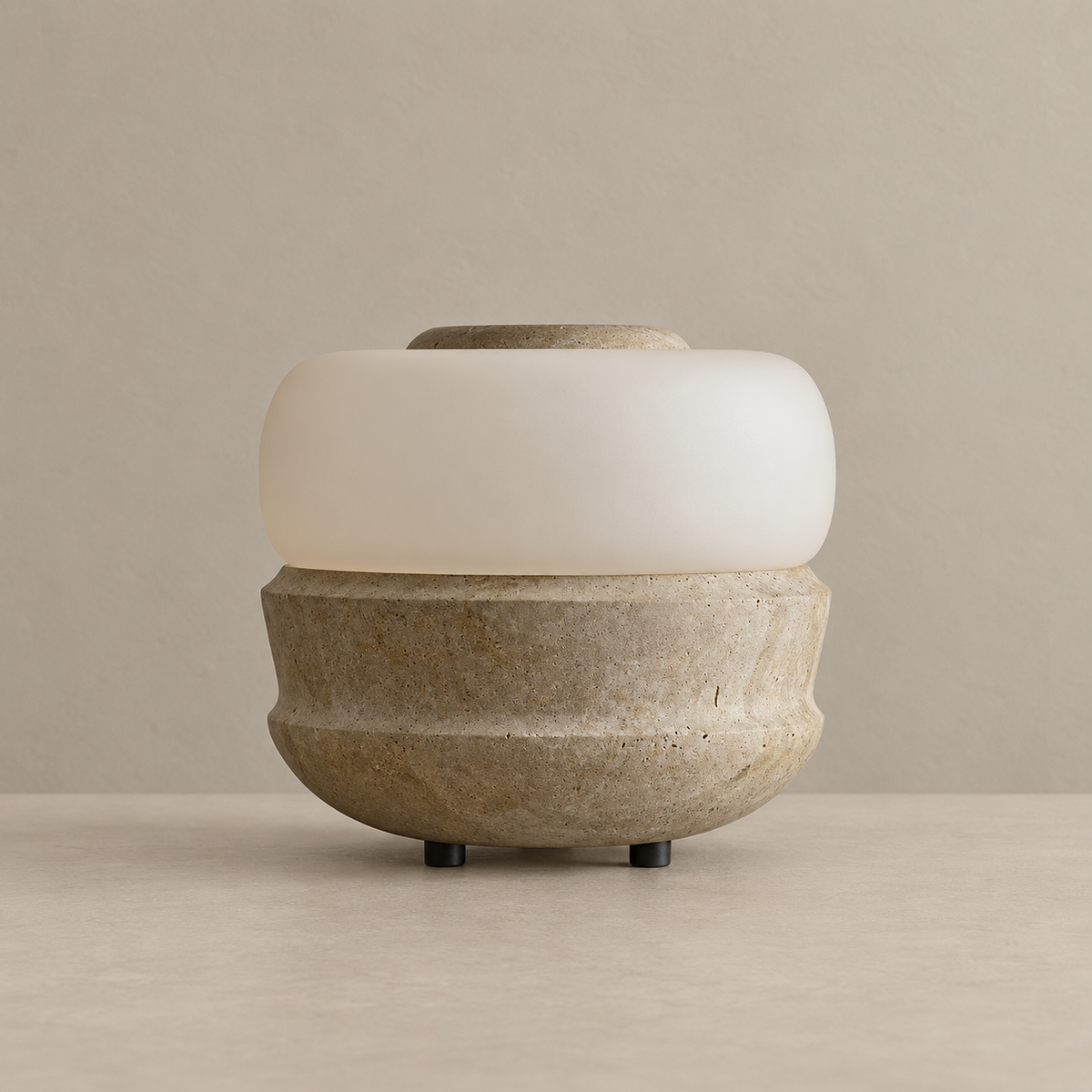 Compact stone table lamp with a frosted glass band, unlit on a beige background