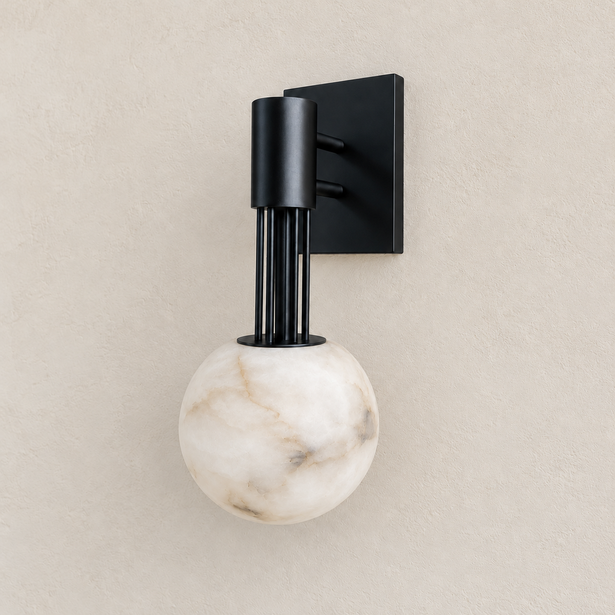Three-quarter view of the black sconce showing its alabaster globe and rectangular mounting plate.