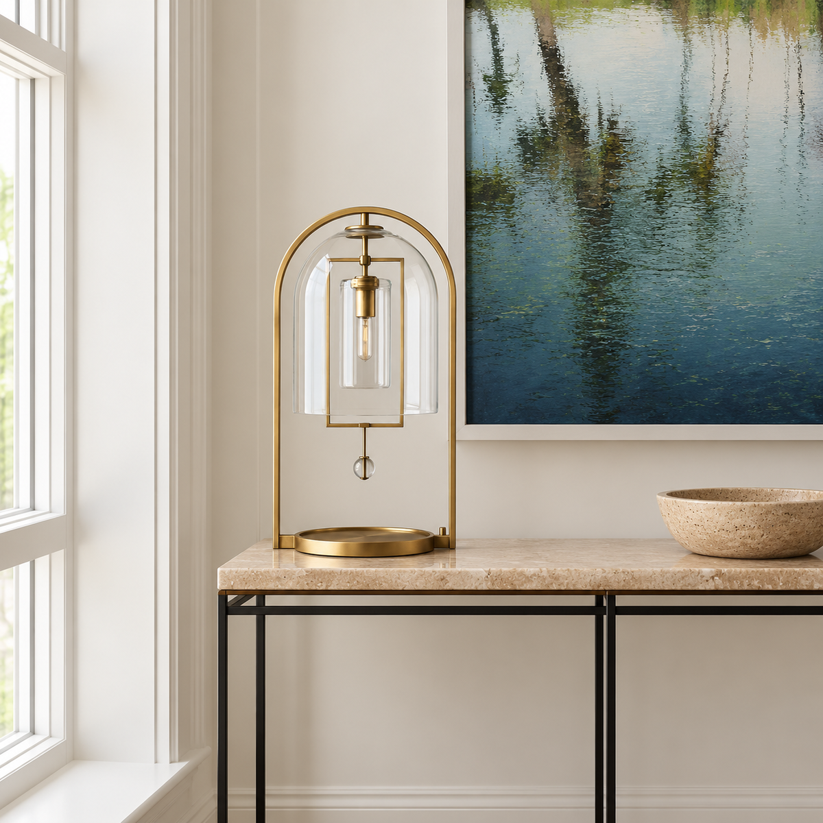 Brass and glass dome lamp on a stone-topped console.
