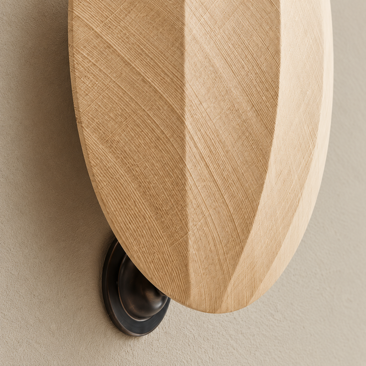 Detail of oak grain, bevelled edge and dark mounting bracket.