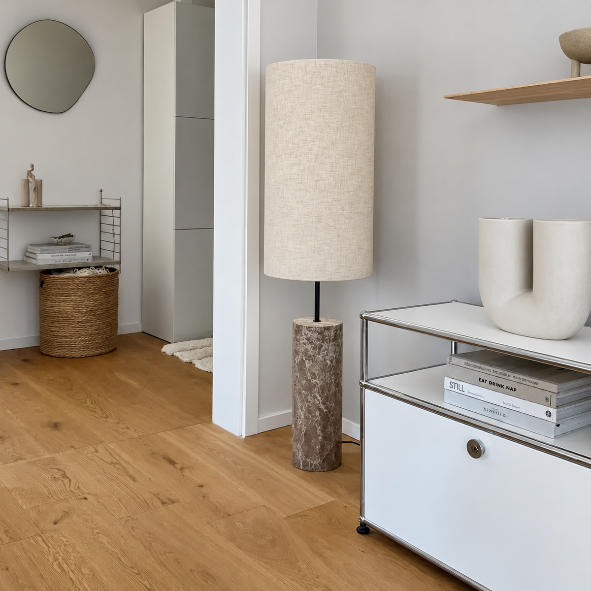 CLMARBHS45 floor lamp beside a white cabinet with chrome framing in a daylight interior.