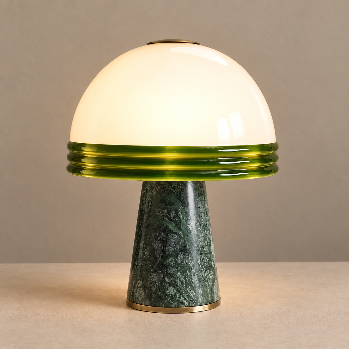 Illuminated glass dome above a green marble base.