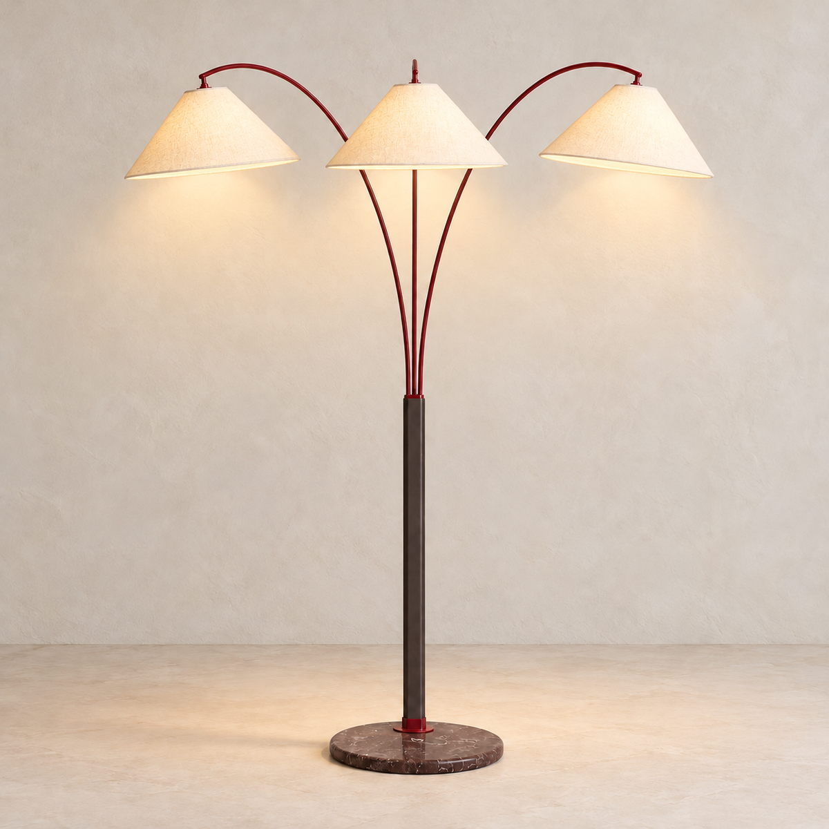 Triple-arm floor lamp with all three linen shades illuminated on an ivory background.