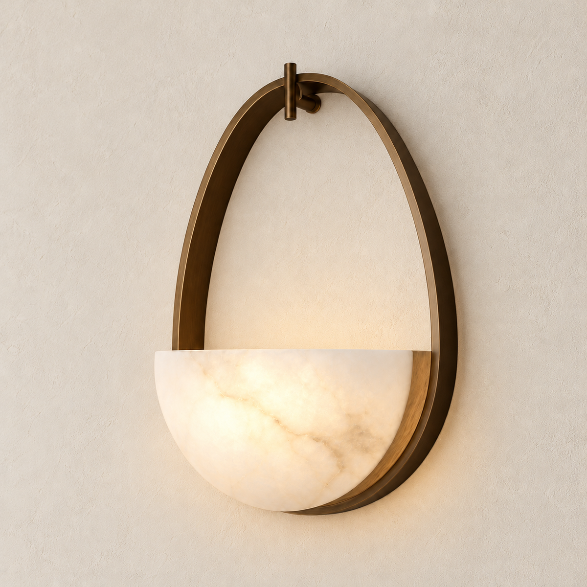 Illuminated alabaster half-bowl suspended within a bronze oval.