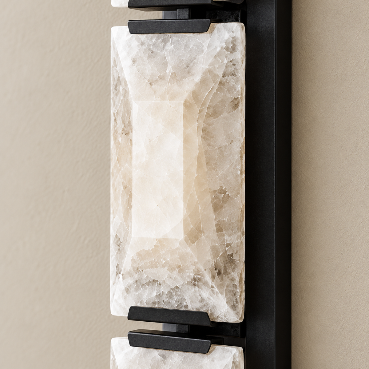 Detail of bevelled calcite and black mounting hardware.