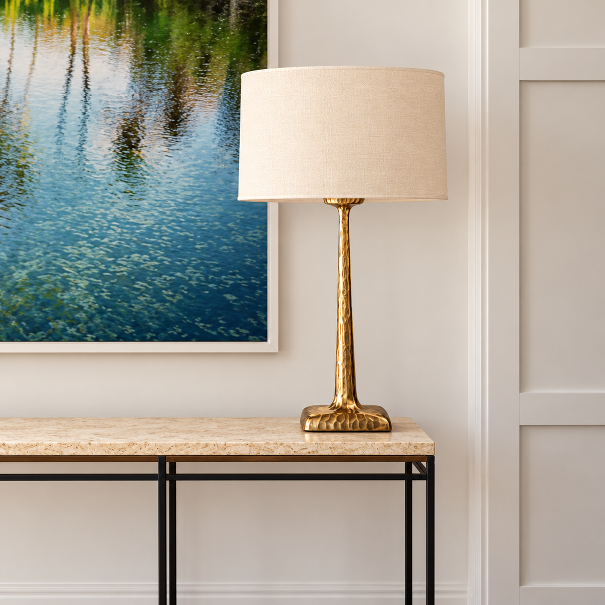 Tall hammered copper lamp on an entryway console.