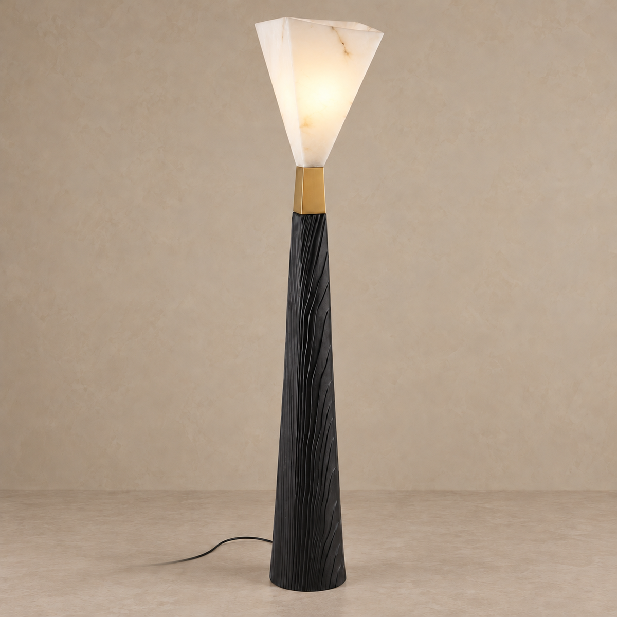 CLZX89550 floor lamp with its faceted shade illuminated above the gold collar.