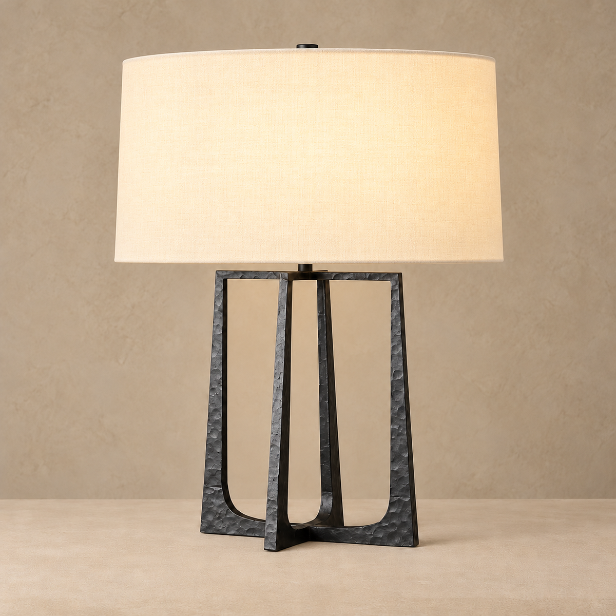 Hammered Copper Table Lamp, illuminated, on a beige background.