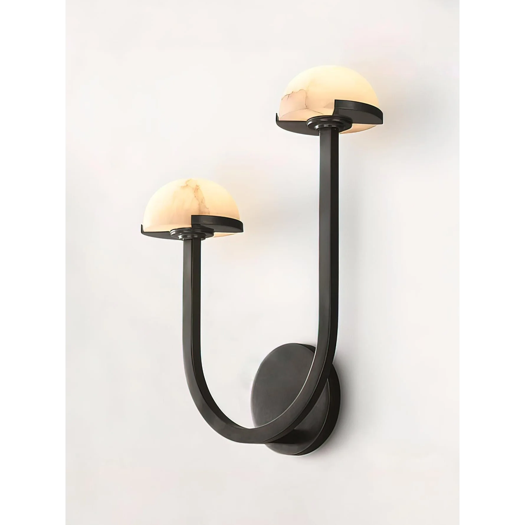 U-shaped brass arm detail in black