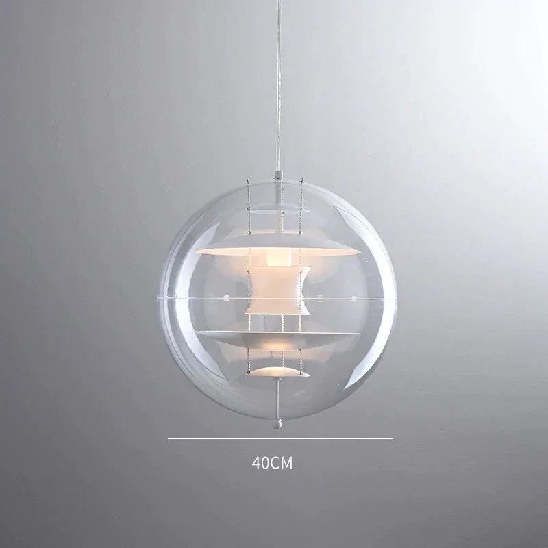 Globe LED pendant beside a bed