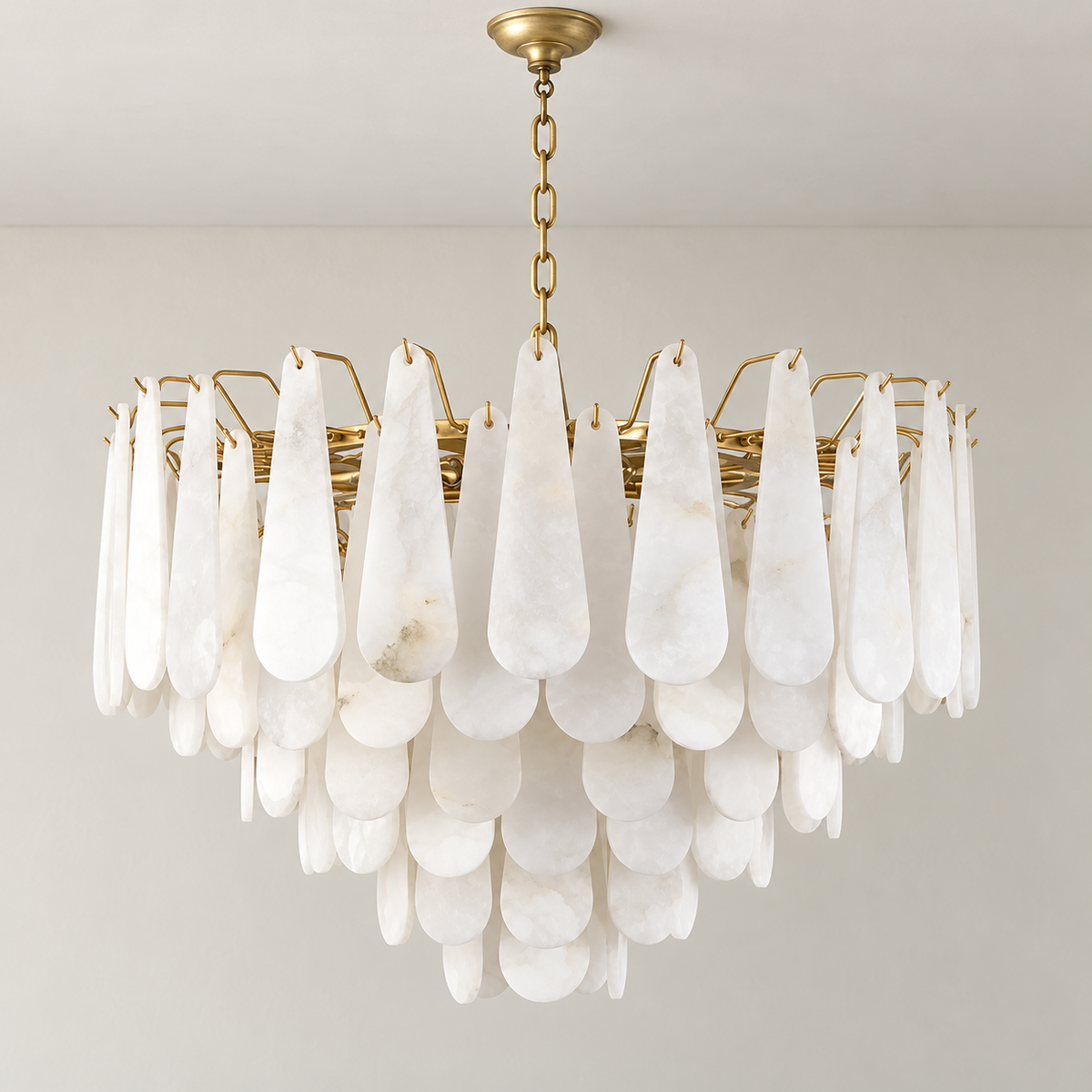 Goccia chandelier unlit, showing cascading alabaster teardrops and brass suspension.