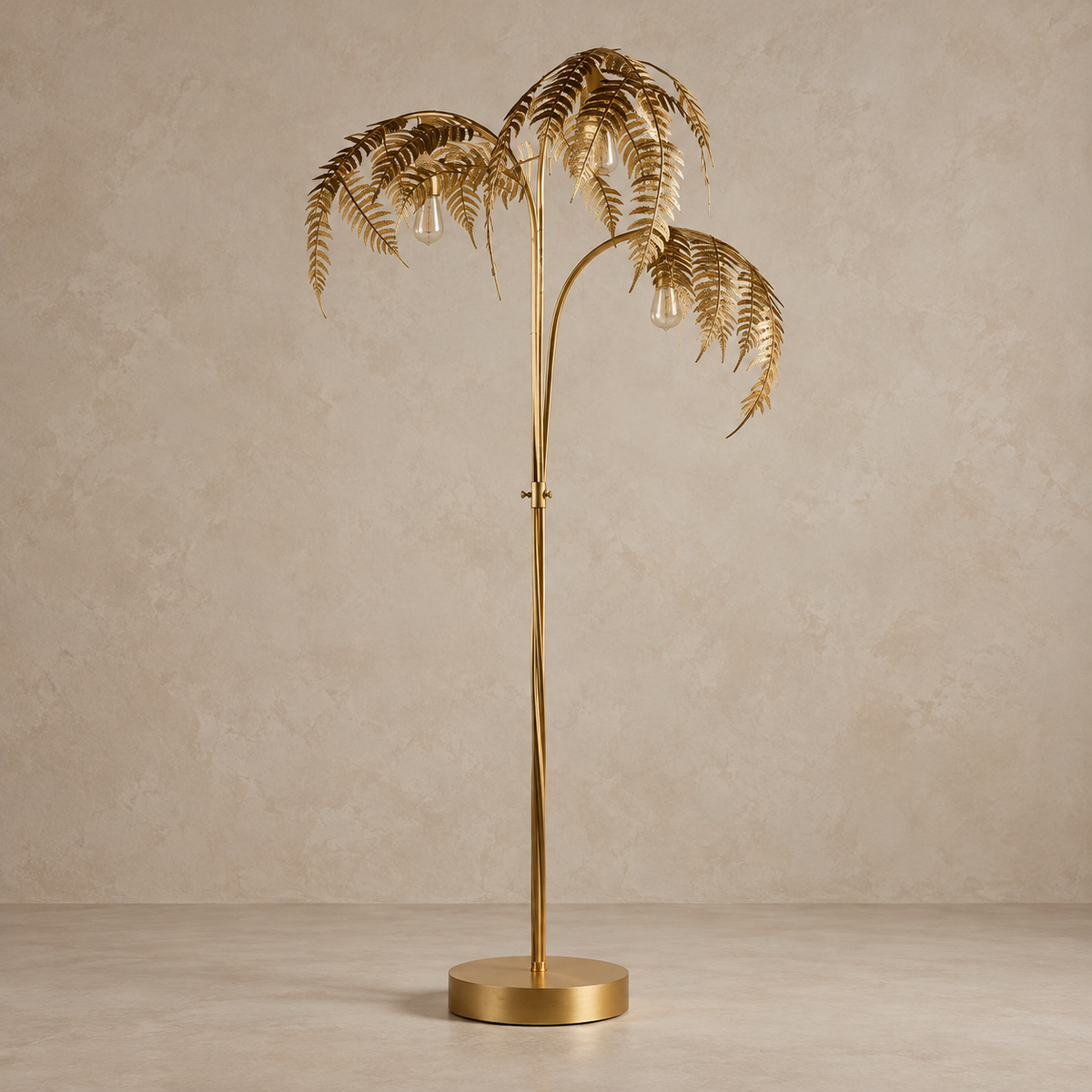 Gold palm-tree floor lamp with three leaf crowns and a round base, switched off.