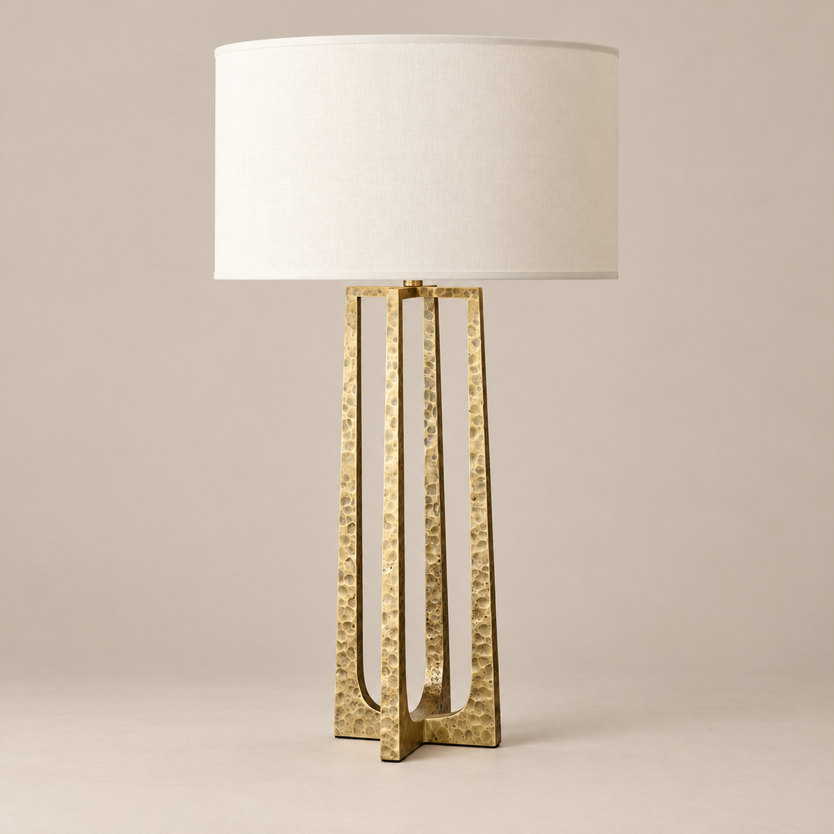Hammered copper table lamp switched off on a beige background
