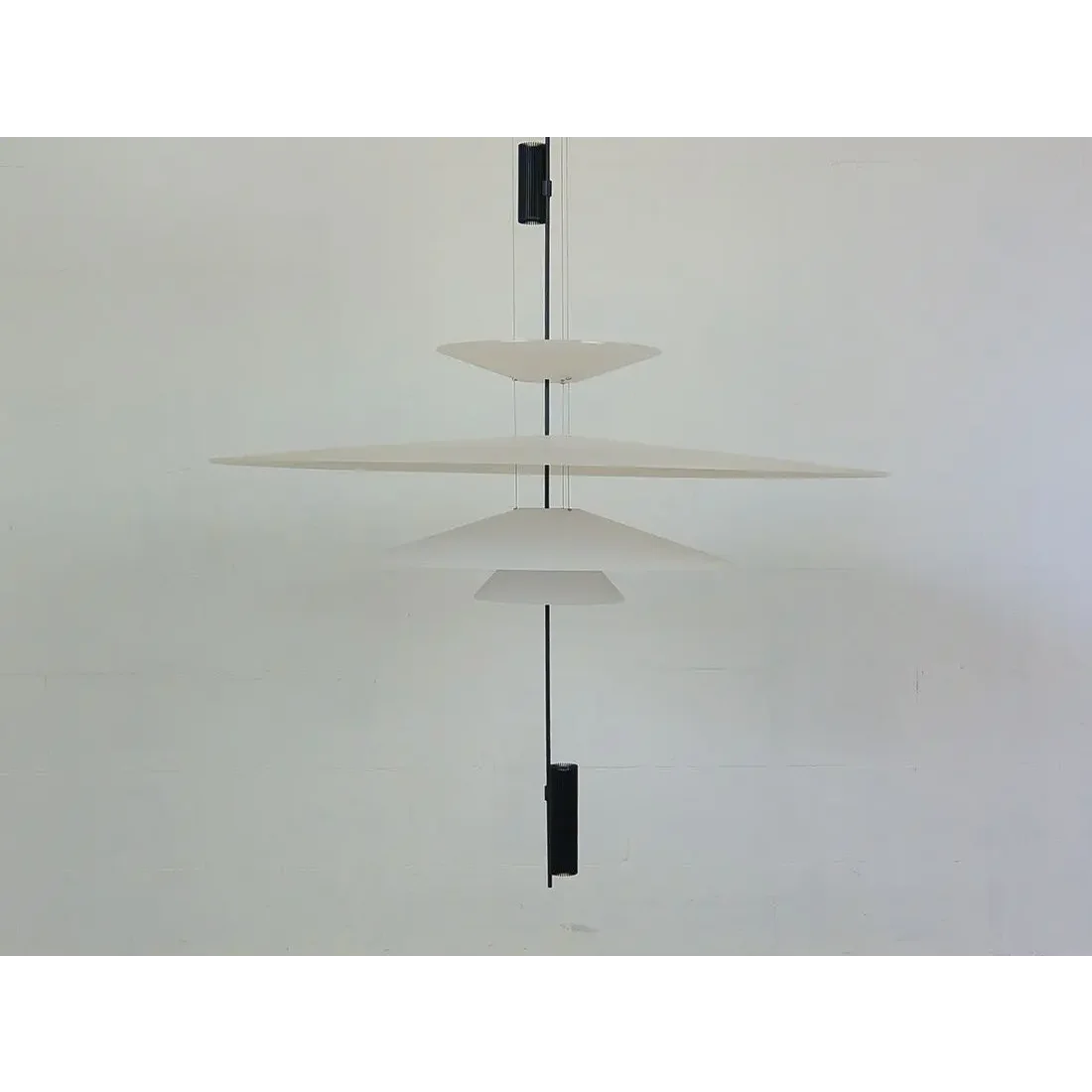 Layered acrylic pendant in a foyer