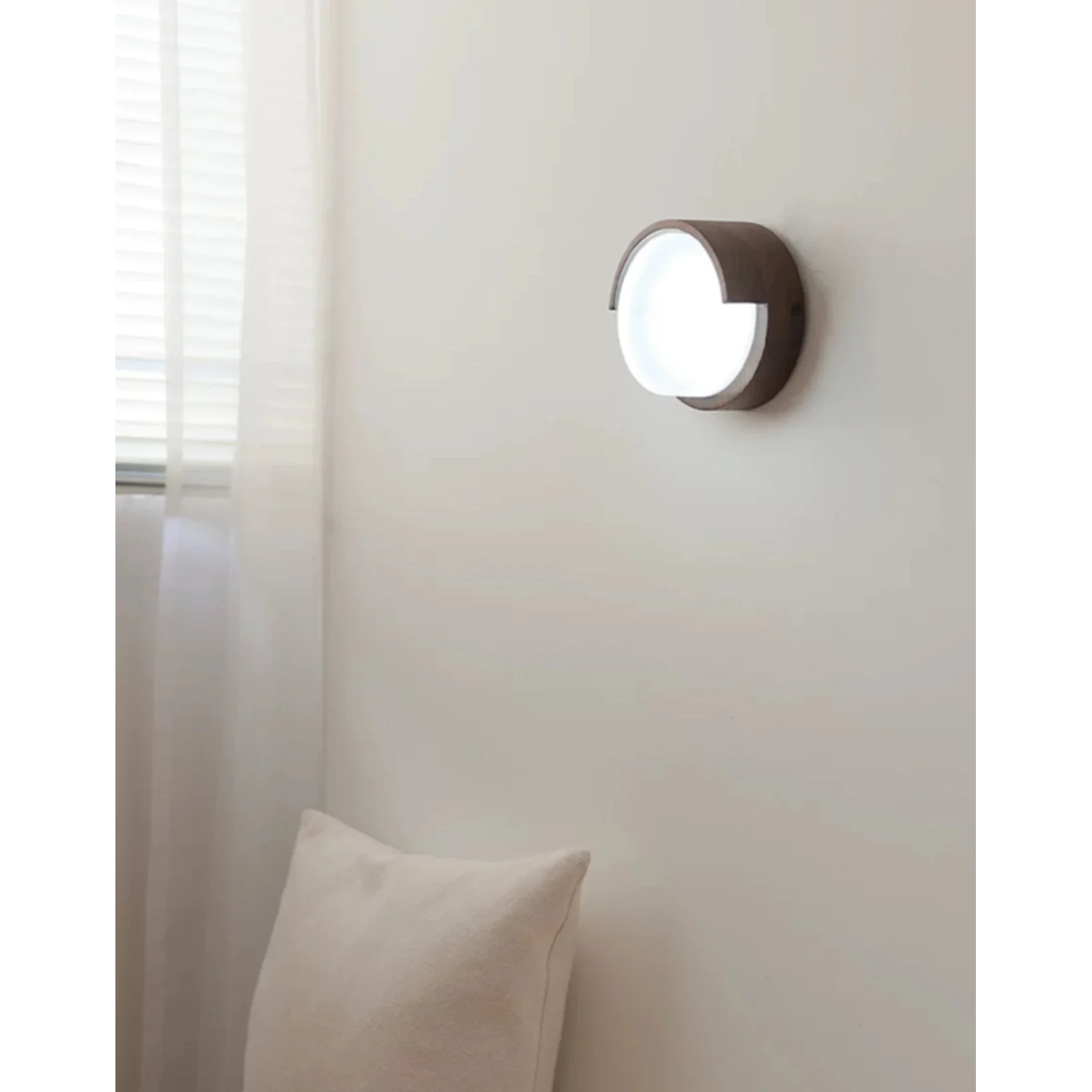 Japandi walnut sconce glowing warm