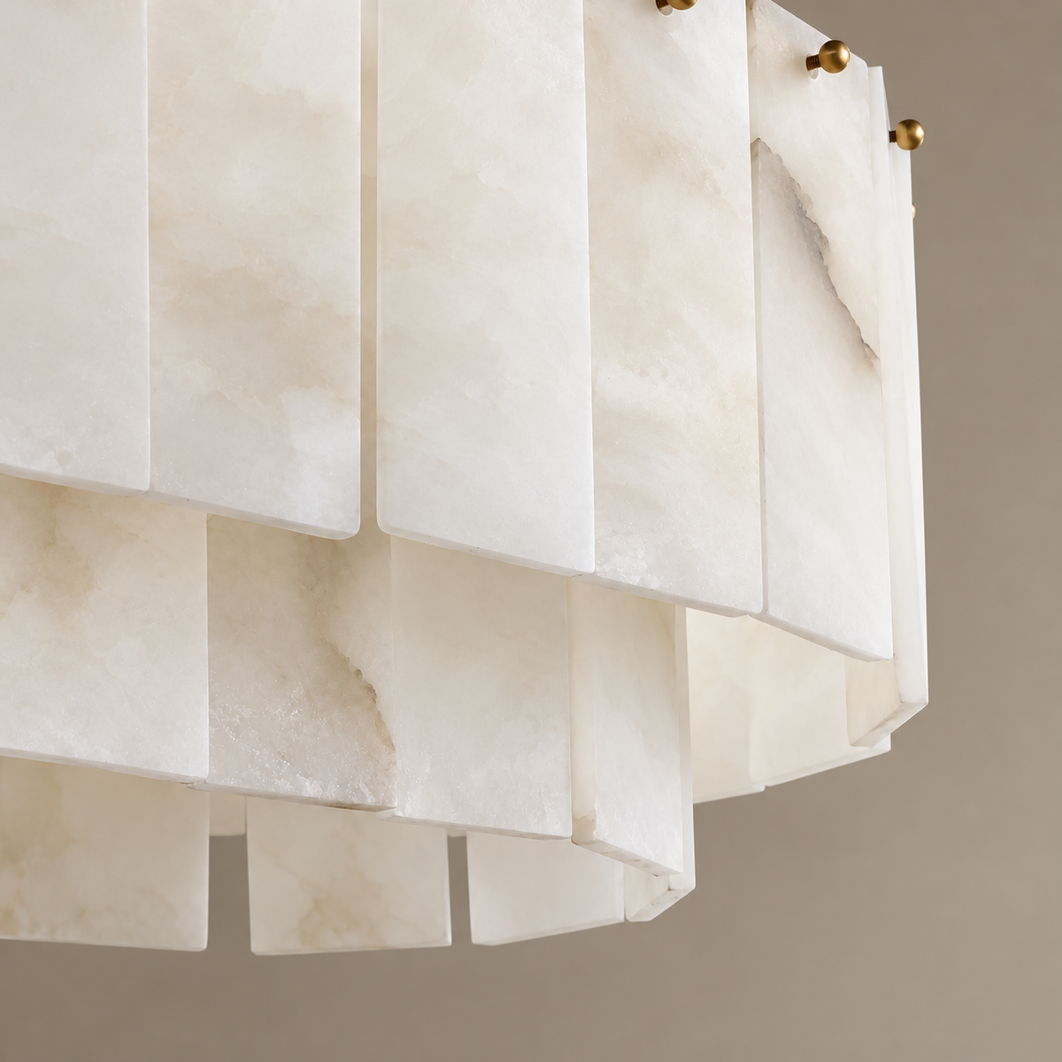 Natural alabaster clouds, mineral veins and brass pins on the Joan chandelier.