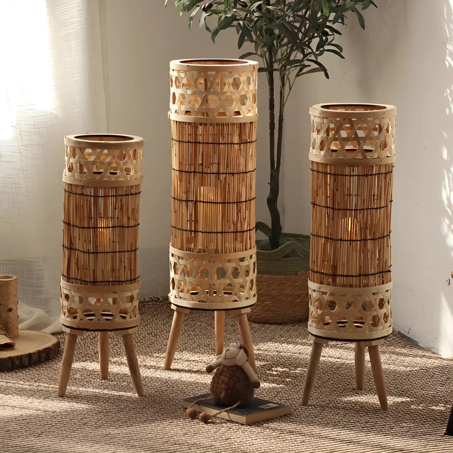 Openwork bamboo tower floor lamp with a warm glow