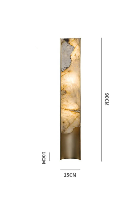 Tall onyx stone sconce glowing warm