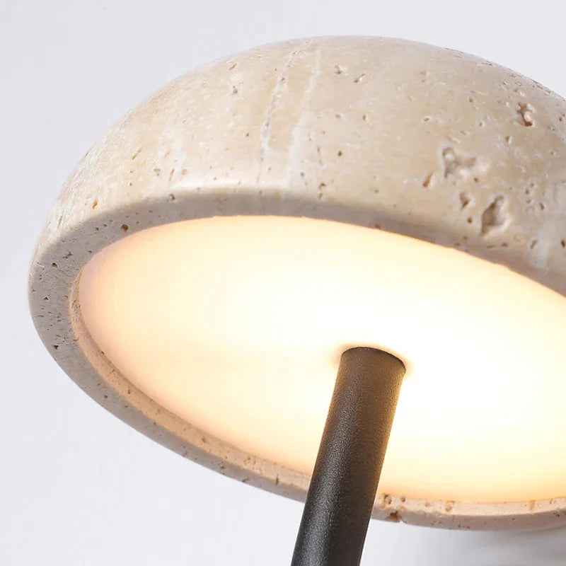 Travertine wall light in an entryway