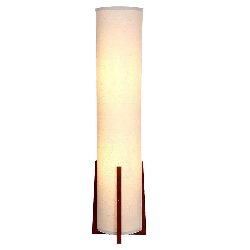 Wood table lamp with fabric shade glowing warm