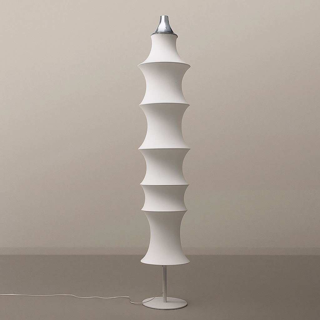 Modern white floor lamp with a geometric design against a beige wall.