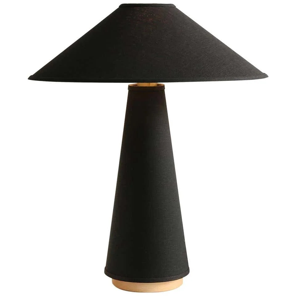Textile-shade table lamp on a nightstand