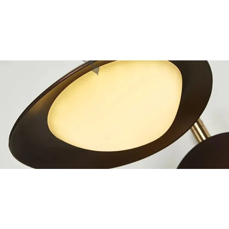 Black swing-arm reading light over a desk