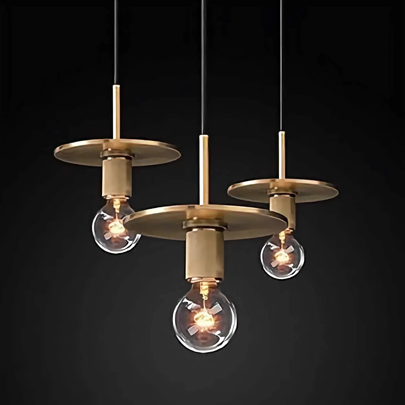Brass disc pendant in a dining room