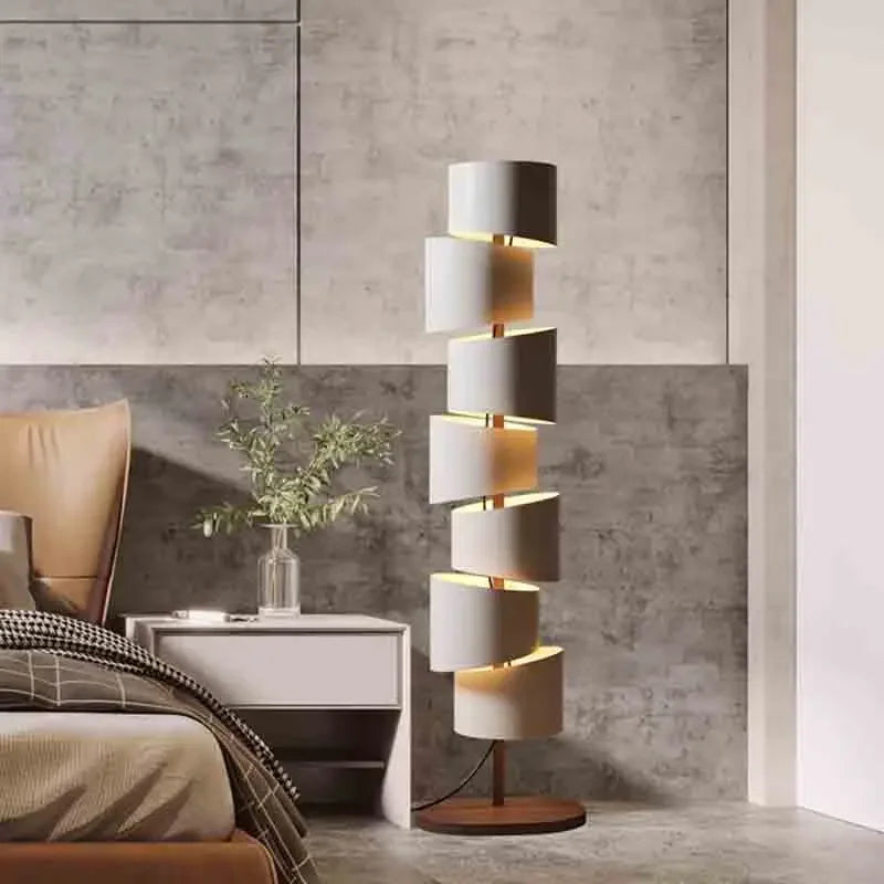 Modern iron tower floor lamp beside a chair