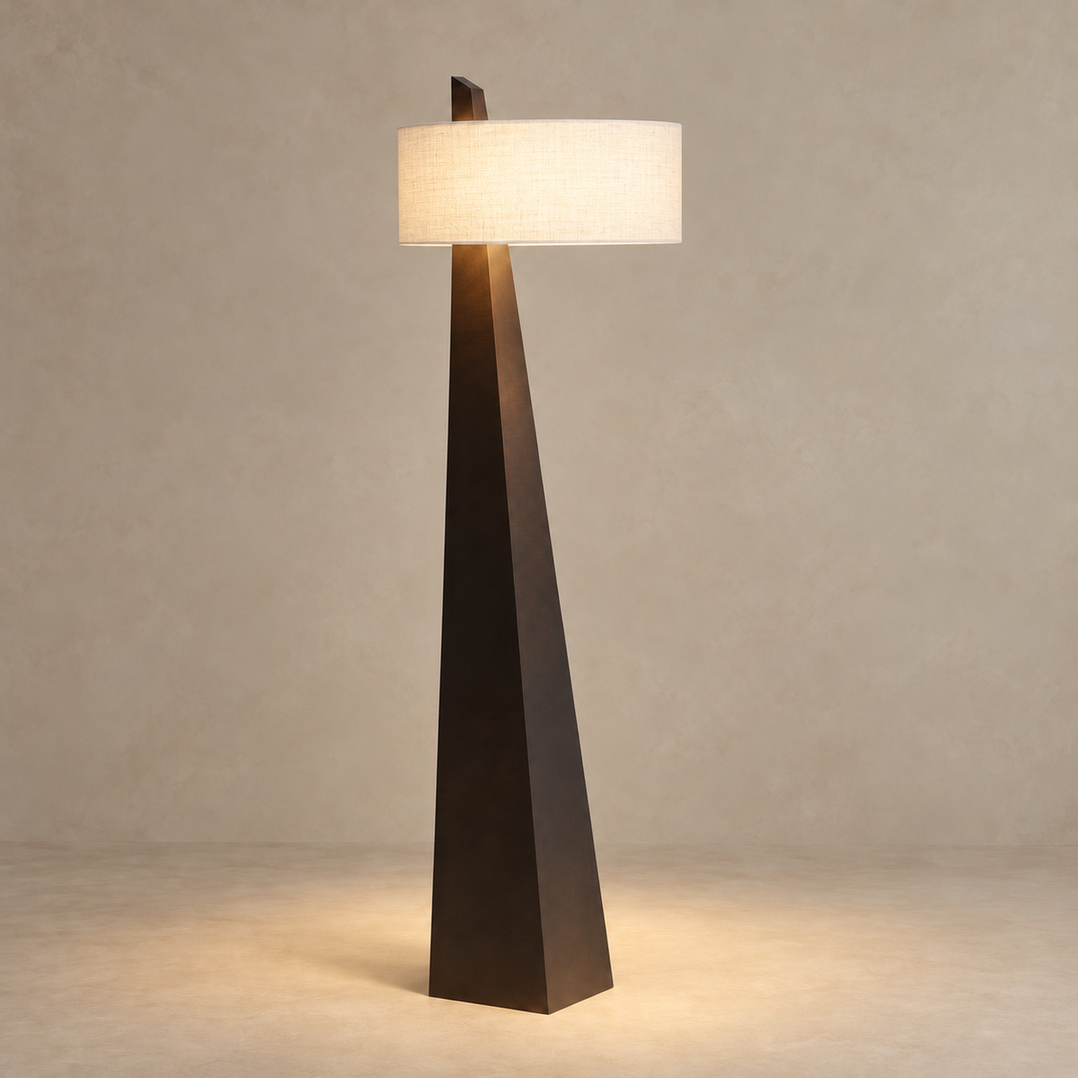 Monolith CLVMO0280 floor lamp illuminated, with a softly glowing linen shade above its faceted wood body.