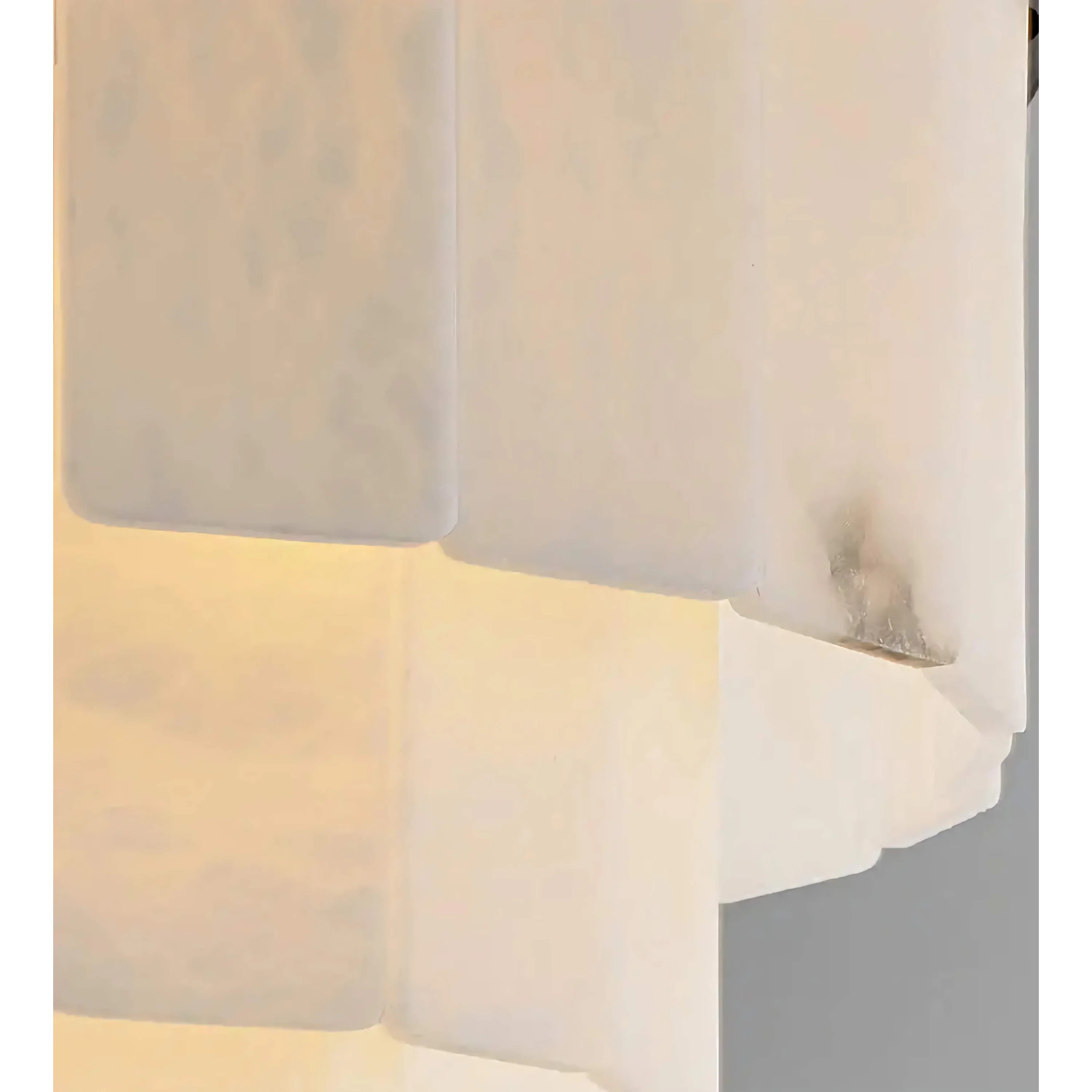 Linear alabaster chandelier in a dining room