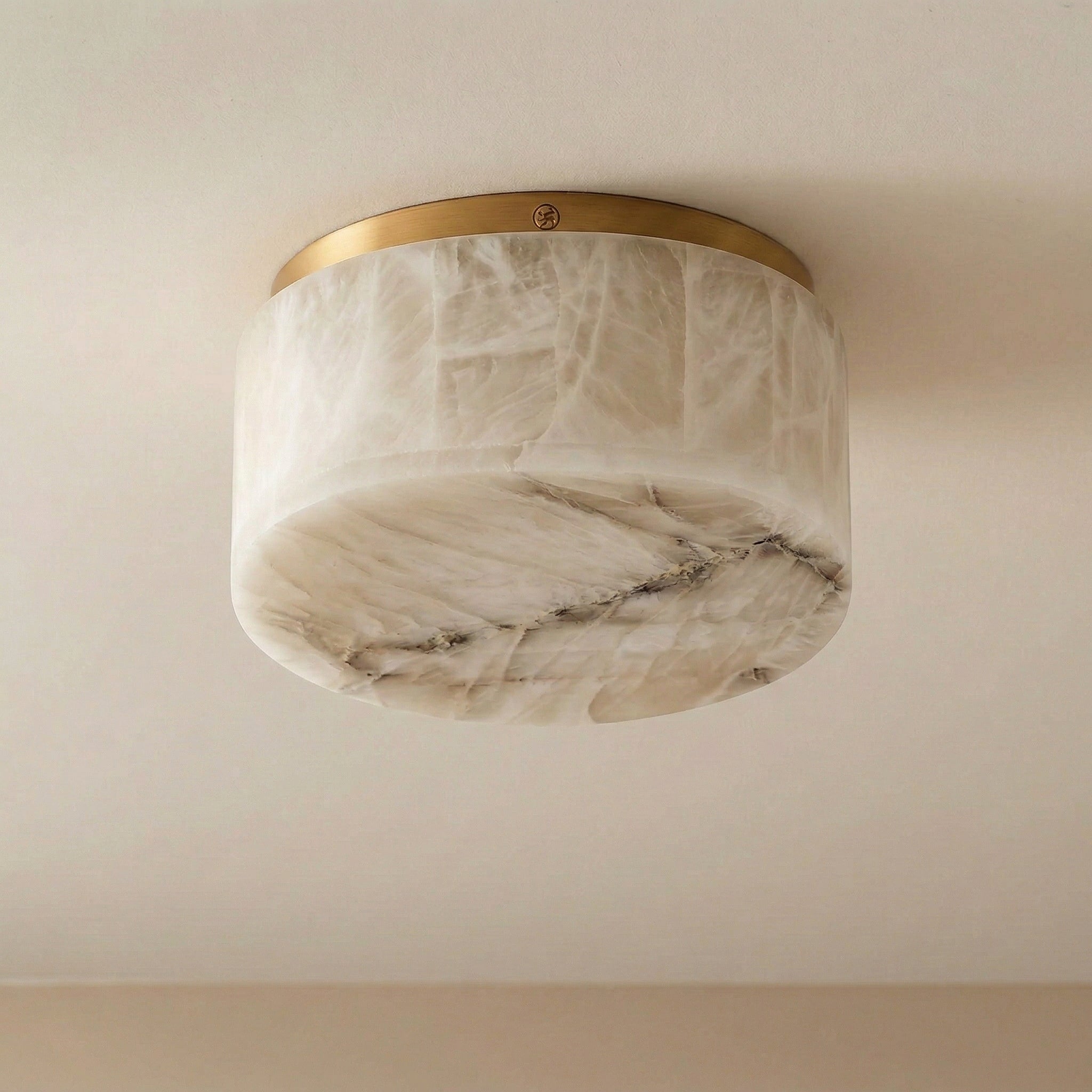 Alabaster flush mount above a shower