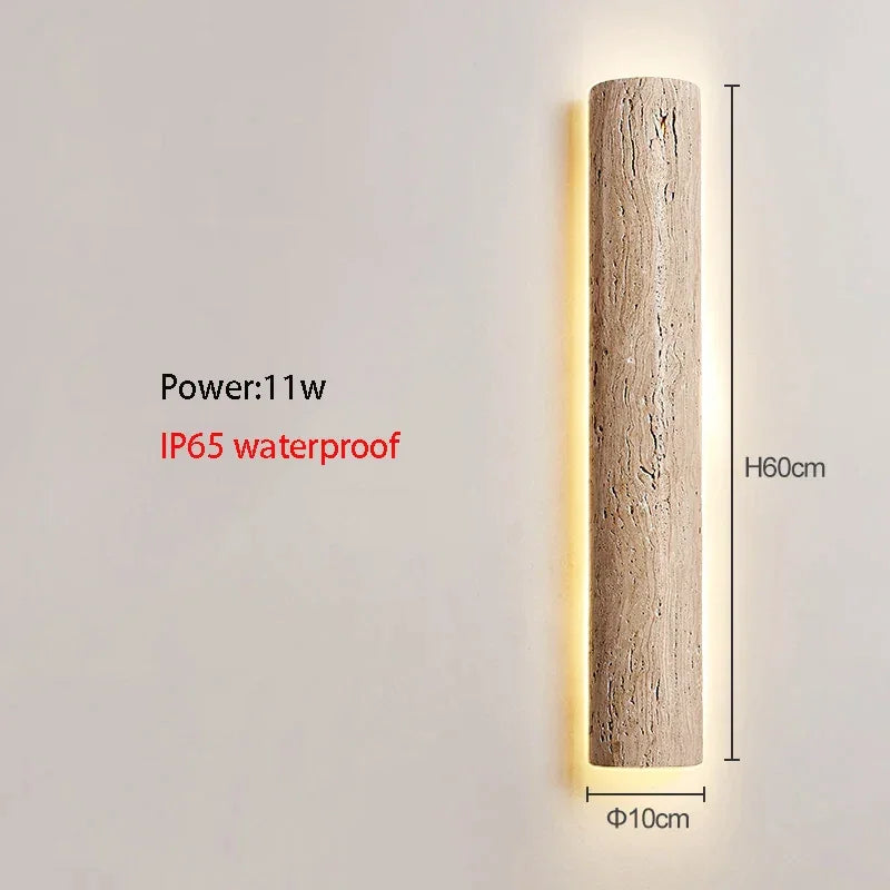Long travertine wall light in an entryway